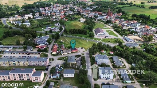 Działka zabudowana budynkiem usługowo - handlowym