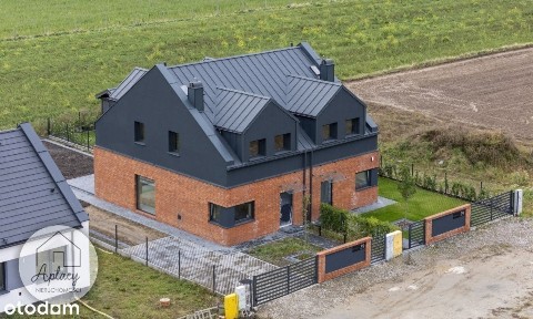 dom z cegły klinkerowej ogród urządzony podłogówka