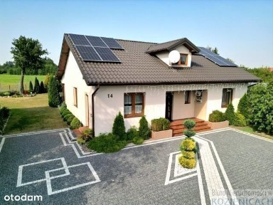 Nowoczesny dom z pięknym ogrodem.