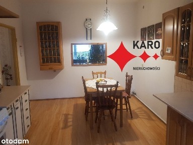 Dom w Trzcielu, duży budynek gospodarczy, ogród