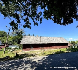 Drewniany dom na 13 ar działce- Chorkówka.