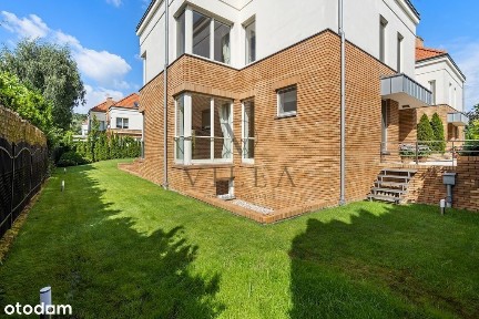 Dom w enklawie zieleni Wilanów / Zawady