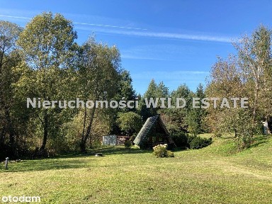 Na sprzedaż urokliwa działka przy potoku z domkiem