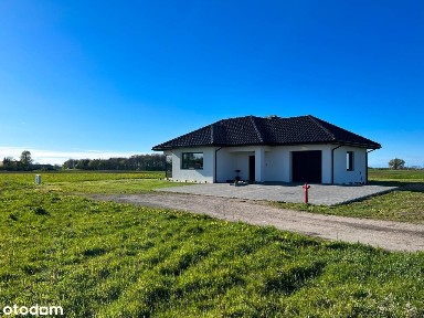 Elegancki dom parterowy z garażem w bryle budynku oraz dużą działką !