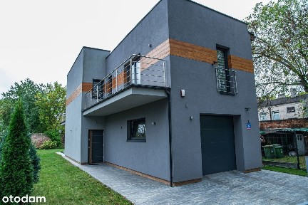 Nowoczesny dom z garażem w cichej okolicy w środku miasta