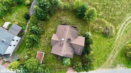 Dom wolnostojący w okolicy lasu, stan surowy zamkn