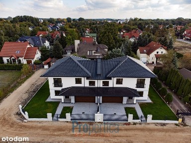 Połówka bliźniaka z garażem na 2 samochody