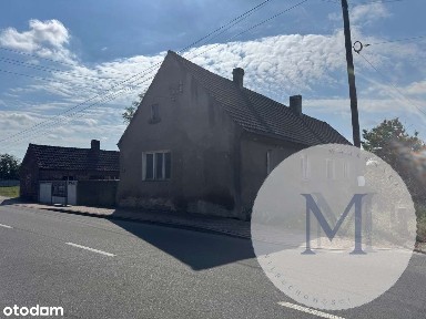 Dom wolnostojący z zabudowaniami gospodarczymi