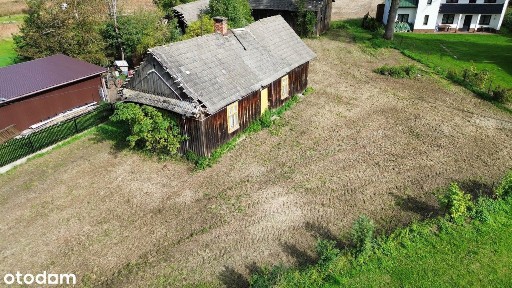 Działka 39 arów z domem drewnianym i zabudowaniami gospodarczymi!