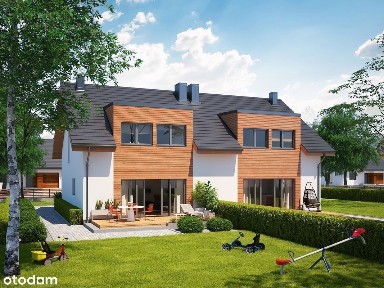 Dom na wzniesieniu pod lasem.