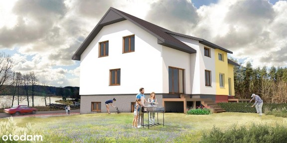 Nowoczesny dom na ścianie lasu z widokiem na jezioro