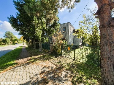 Przestronny dom z ogrodem i garażem - nieruchomość z potencjałem