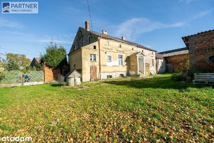 Dom z zabudowaniami na dz. 4 400 m2 (udział 1/2)