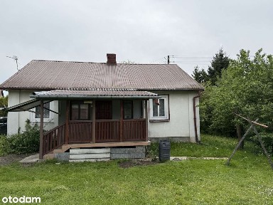 Dom drewniany z budynkami - Grabowiec