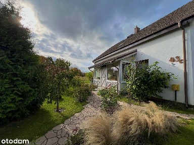Dom z pięknym ogrodem z podziałem na dwa mieszkania w centrum Łęgajn.