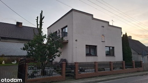 Przestronny dom z garażem i ogrodem na sprzedaż