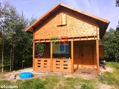 Drewniany dom nad jeziorem Lucieńskim