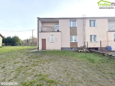 Dom w zabudowie bliźniaczej z dużą działką