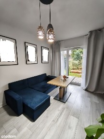 Dwupokojowe mieszkanie z klimą, ogrodem i podziemnym miejscem garaż.