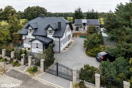 Dom z częścią gospodarczą i ogrodem koło Uniejowa