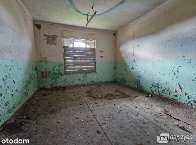 Część domu mieszkalno-usługowego.