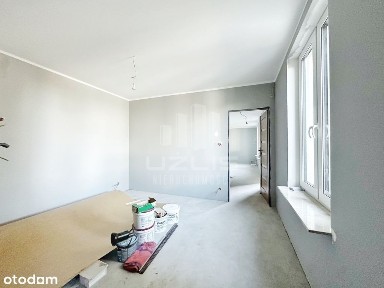 Przestronne mieszkanie z ogrodem i garażem.