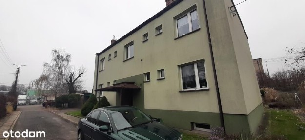 2 pokoje z ogródkiem i parkingiem.