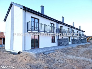 Dom szeregowy z garażem, ogrodem i pompą ciepła