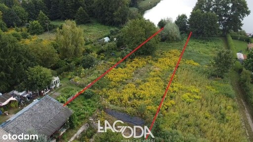 Dom z działką 25 arów przy linii brzegowe jeziora.