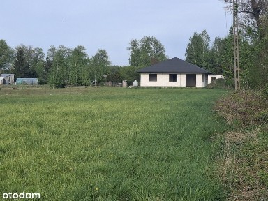 Działka budowlana z domem w stanie surowym