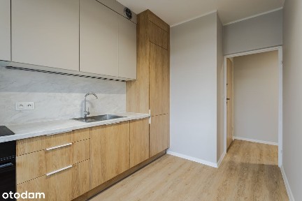 Nowa kawalerka z dużą łazienką, osobną kuchnią i komórką lokatorską