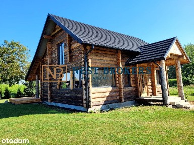 Dom z bali na dużej działce z projektem zabudowy