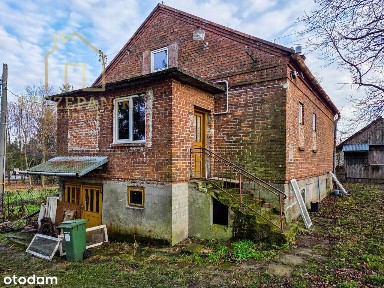Urokliwy Dom z cegły na pięknej 25 arowej działce