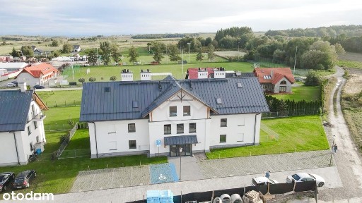 Dwupokojowe mieszkanie z balkonem oraz naziemnym miejscem postojowym