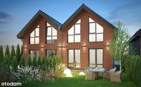 Stylowy dom z cegły klinkierowej w zabudowie wolnostojącej