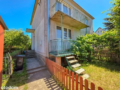 Komfortowe mieszkanie z ogródkiem i garażem.