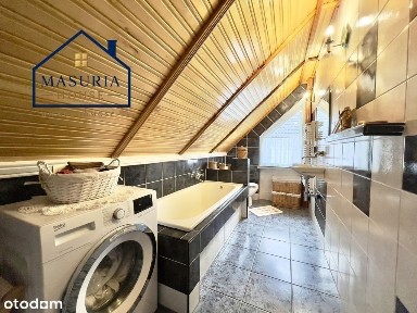 Dom wolnostojący w sąsiedztwie jeziora
