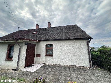 Kameralna połowa domu - - działka, garaż i możliwość rozbudowy