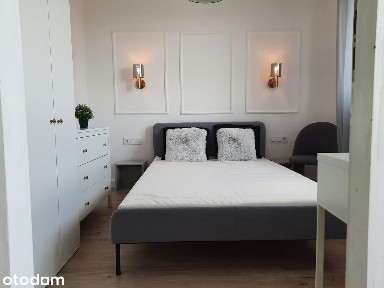 Widok na centrum wraz z przytulnym dwupokojowym mieszkaniem i balkonem