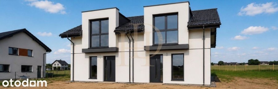 Dom w zabudowie bliźniaczej z wiatą i ogrodem