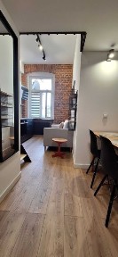 Industrialne mieszkanie w stylu loftowym z sypialnią na antresoli przy Manufakturze, ul.Mielczarskiego 14.