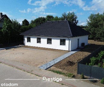 Nowoczesny dom parterowy w budynku dwulokalowym - Głobino