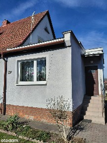 Przestronny dom bliźniak z garażem, piwnicą i dużym ogrodem.