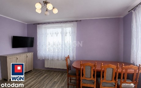 Mieszkanie z ogrodem i budynkami gospodarczymi.