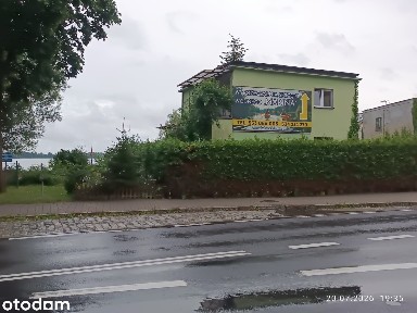 Dom wolnostojący nad jeziorem z garażem.