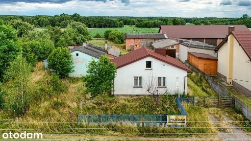 Dom ok. 100 m² z dużą działką 1400 m² i garażem