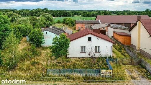 Dom ok. 100 m² z dużą działką 1400 m² i garażem