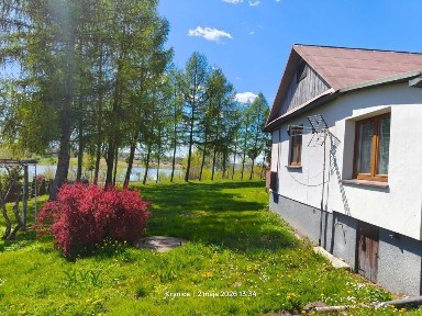 dom z dużą działką nad jeziorem