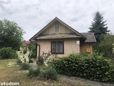 Dom z działka oraz zabudowaniami