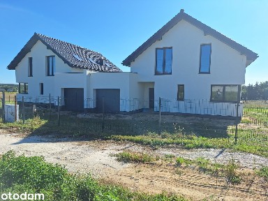Dom bliźniak z garażem w stanie surowym